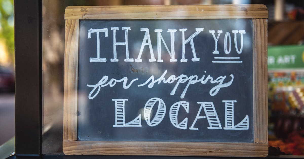 Chalkboard sign encourages shopping local in San Luis Obispo store.