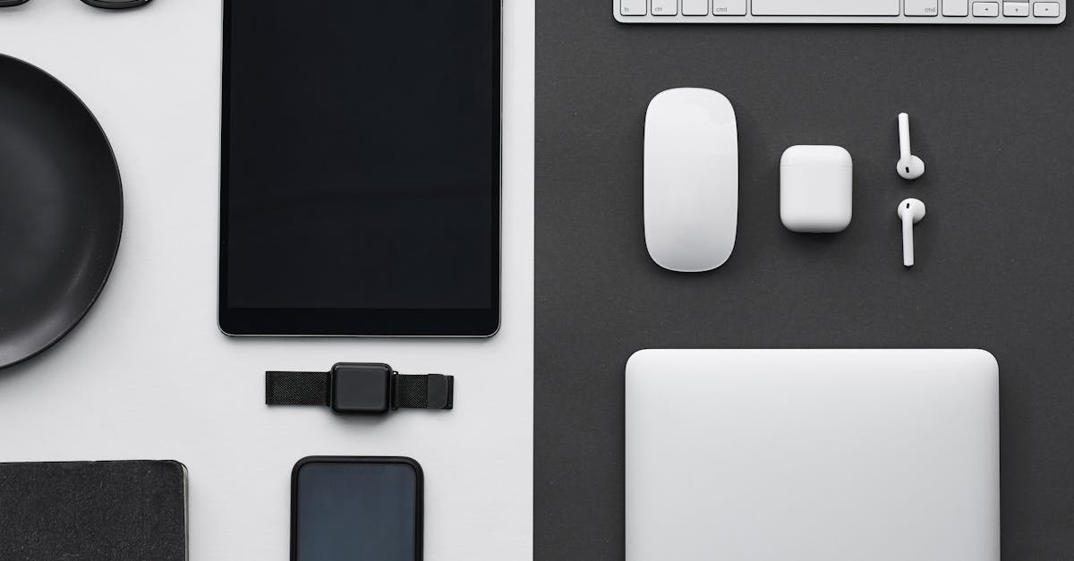 Stylish flatlay of modern tech gadgets including tablet, smartphone, smartwatch, and accessories.