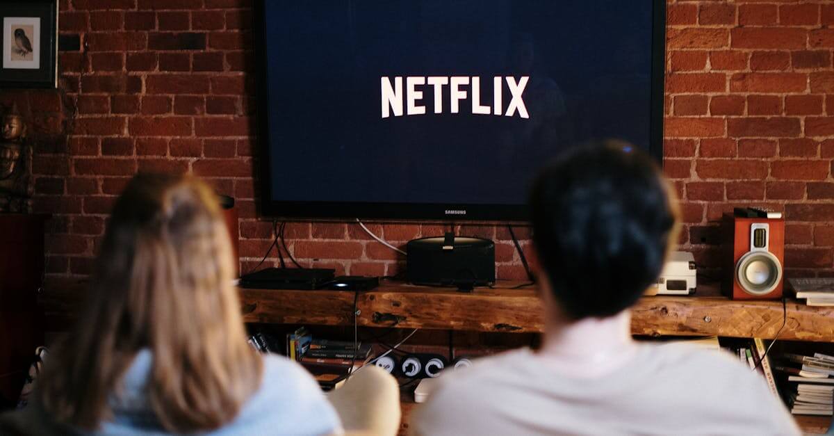 A couple relaxing and watching Netflix in a cozy living room setting.